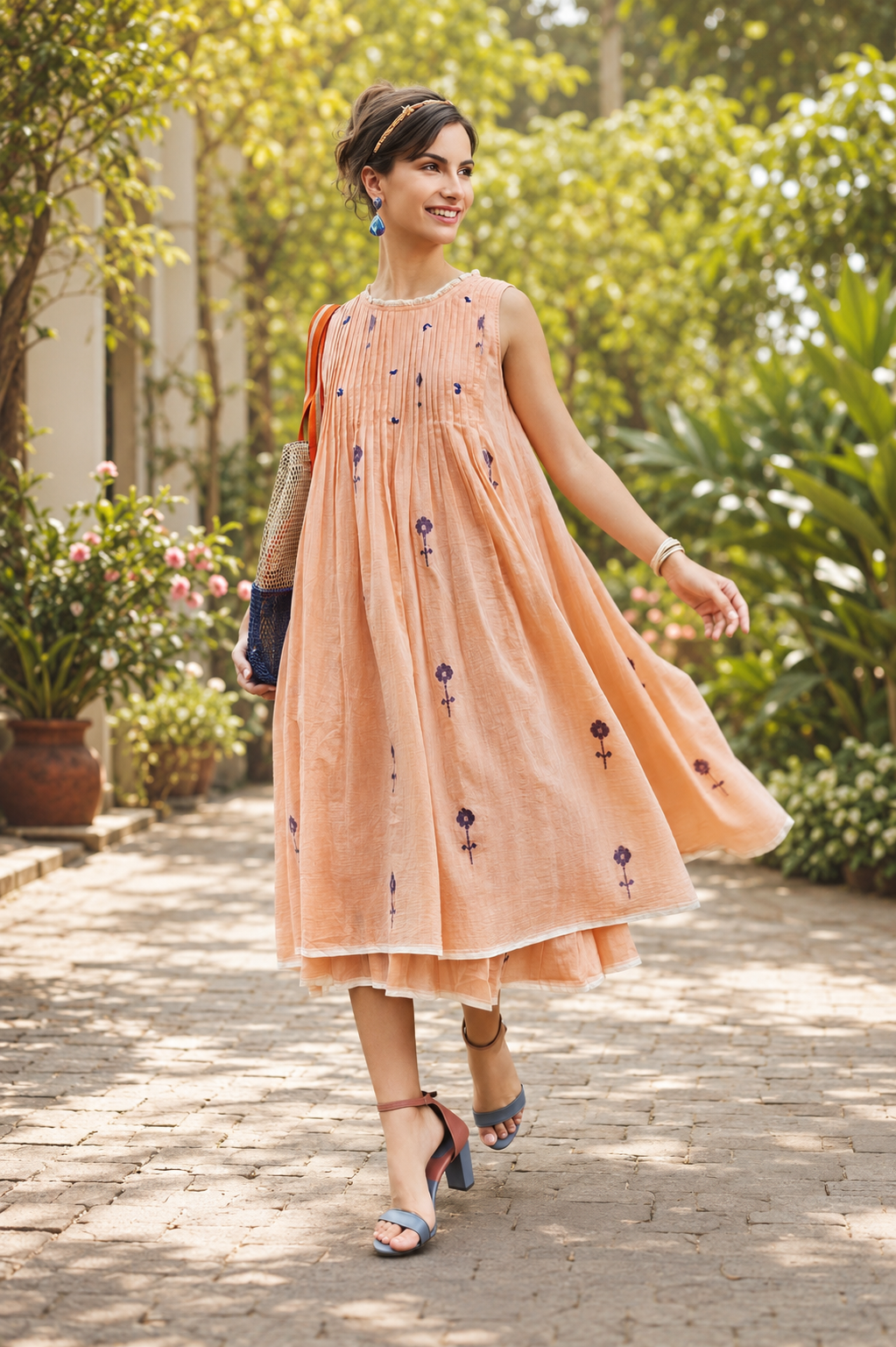 Women's peach sleeveless midi dress with pintuck detailing and floral embroidery